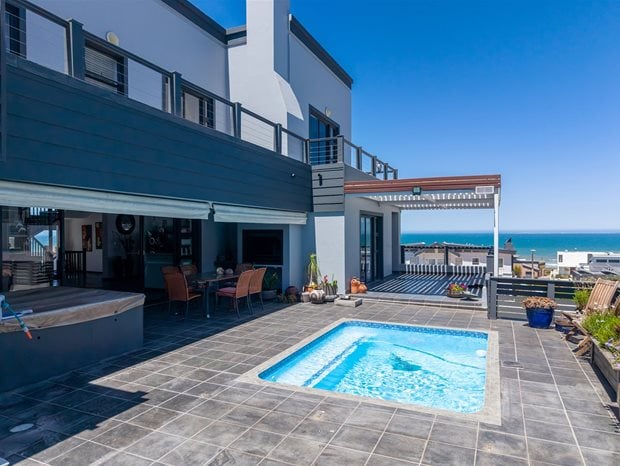Source: Supplied. With four bedrooms and 4.5 bathrooms, this spacious and modern double-storey home in Yzerfontein’s Pearl Bay is ideally situated between an untouched fynbos greenbelt and the endless Atlantic horizon, providing privacy, space and uninterrupted sea views. Priced at R9.25m through Pam Golding Properties, the property includes a backup power system — including solar panels, a Deye inverter and battery storage, a security system and 24-hour armed response.