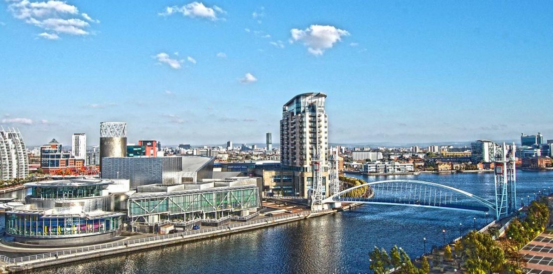 Britain imposes restrictions around Manchester after virus spike